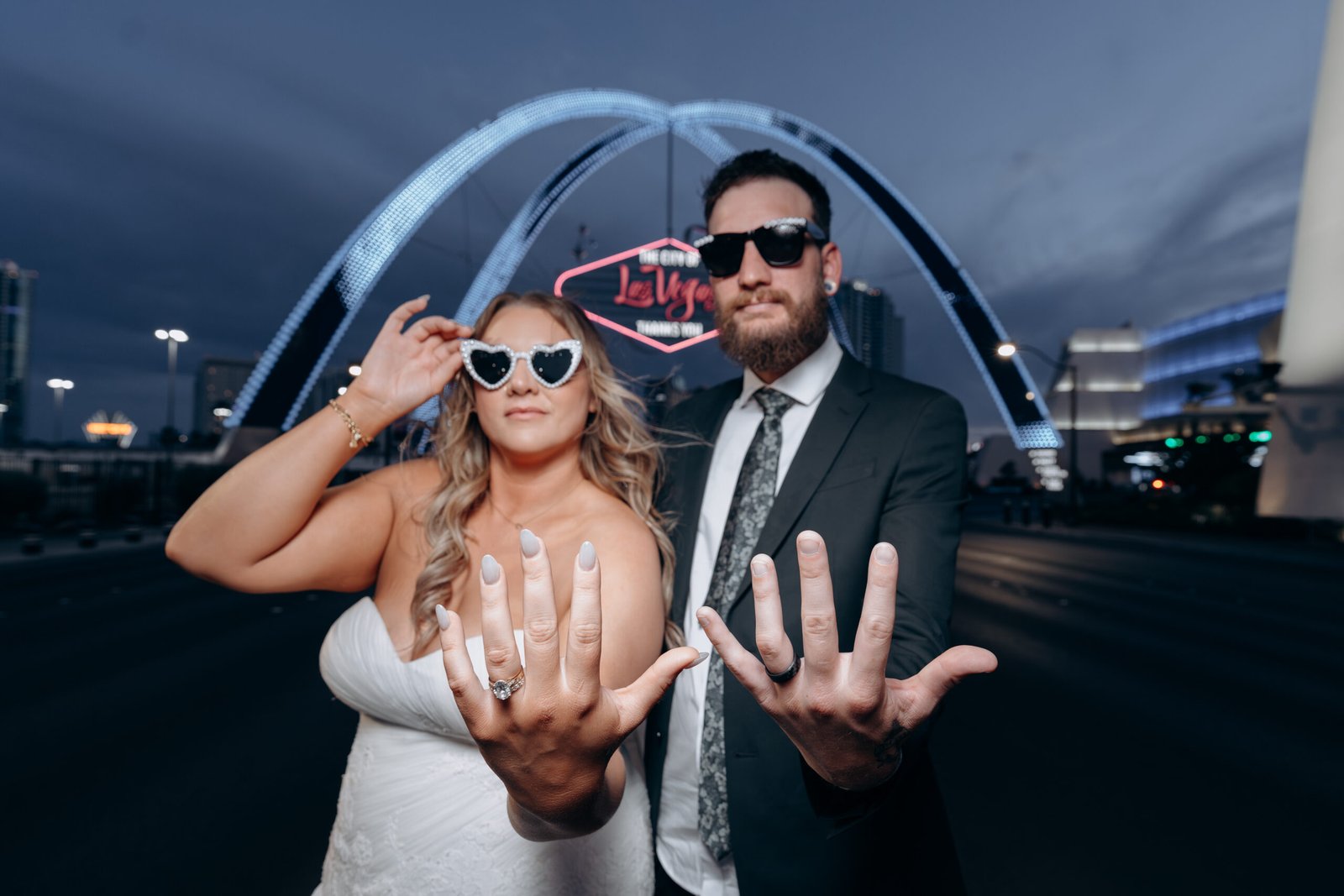 Newlywed couple celebrating together on the Las Vegas Strip after their Las Vegas elopement