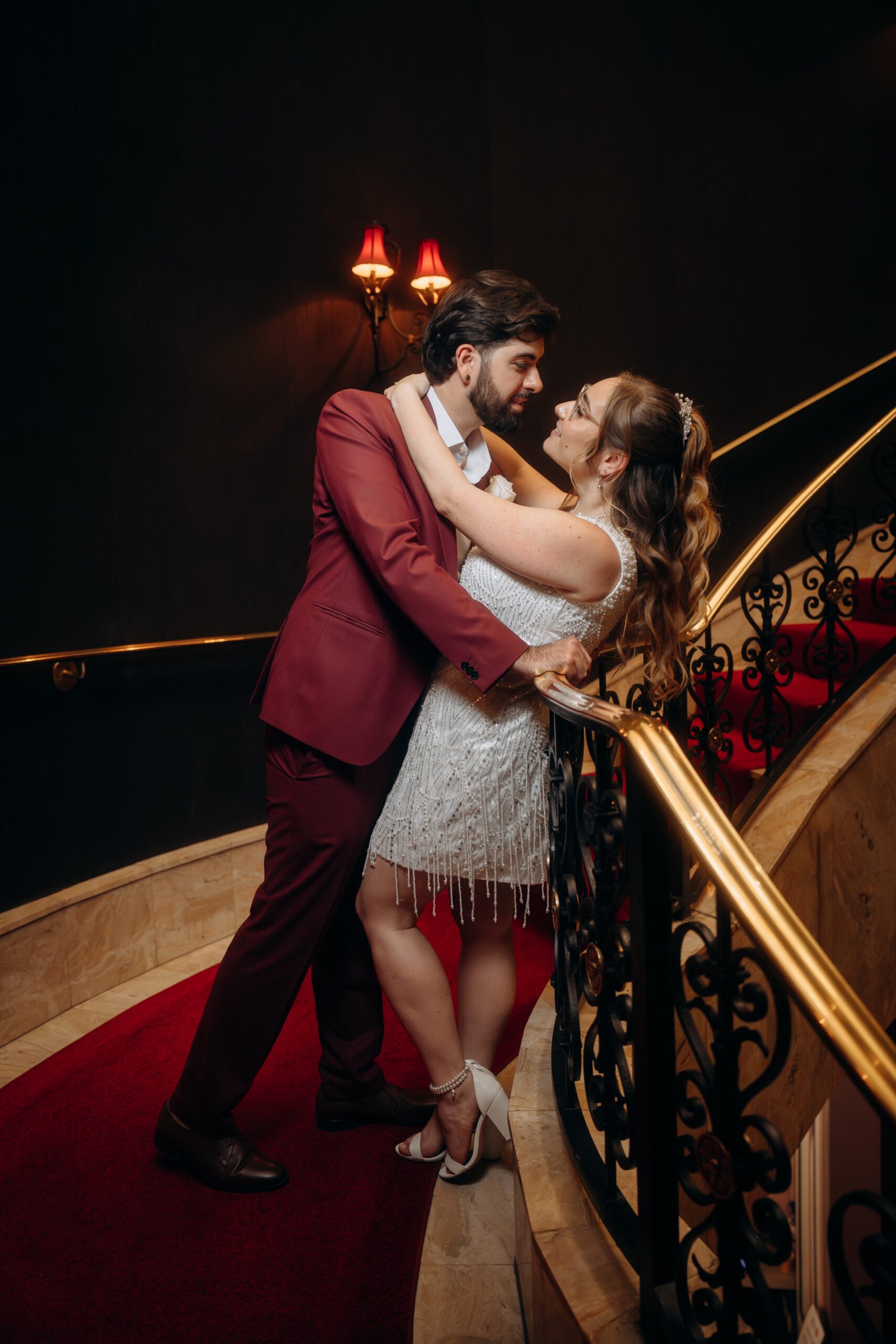Couple celebrating their Vegas elopement inside a casino on Fremont Street
