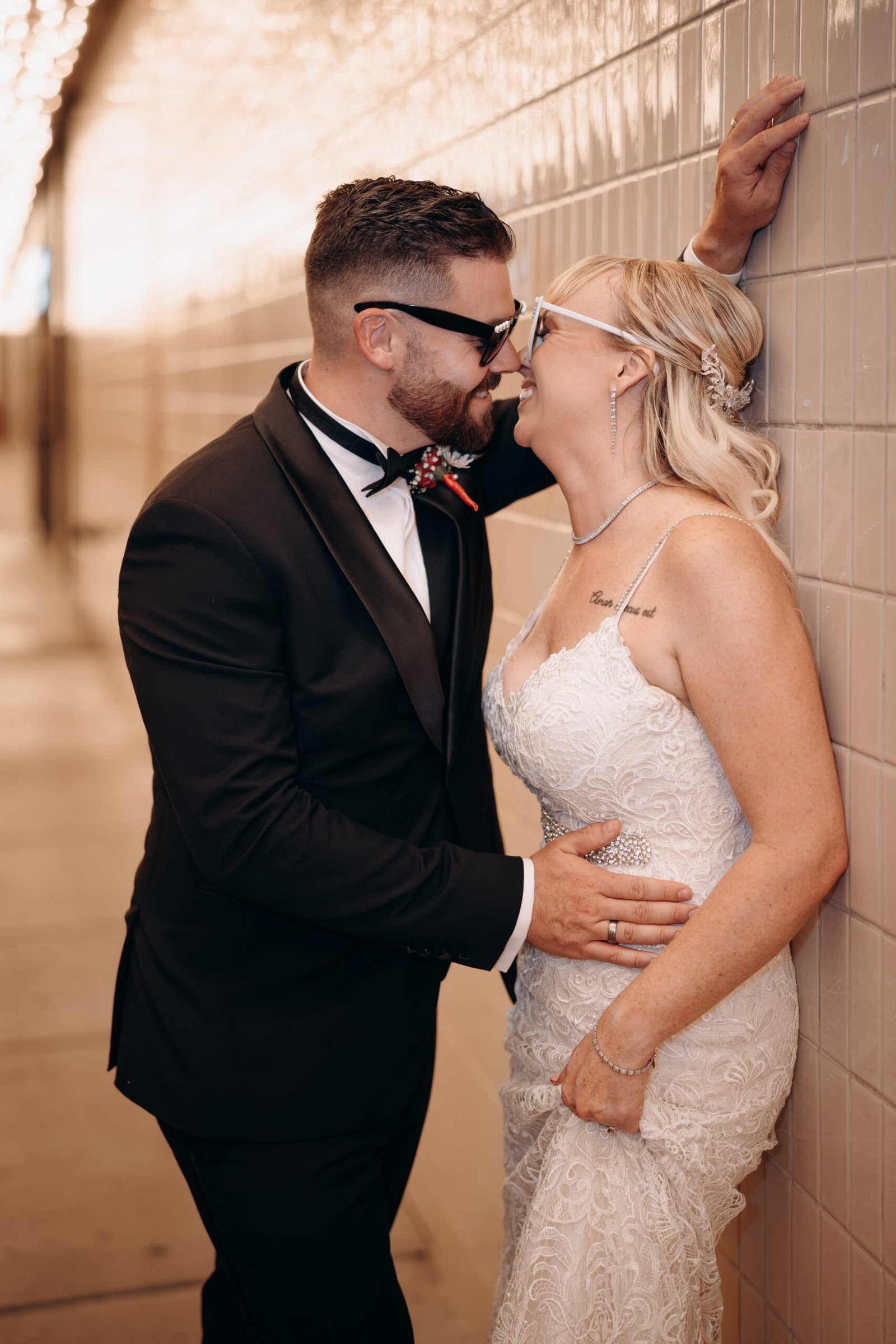 Newlywed couple laughing together under the Fremont Street lights during their Vegas elopement